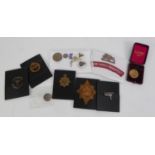 TWO WWII STARS, AFRICA and 1939-45, together with a COLLECTION OF MILITARY CAP AND OTHER BADGES,