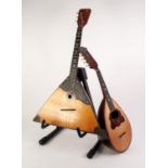 CARLO MARTELLO EIGHT STRING BOWL BACK MANDOLIN, lacks strings and split to front, together with a ?