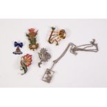 TWO MARCASITE FLORAL SPRAY BROOCHES, TWO ENAMEL GILT METAL BROOCHES viz bagpipes and tartan and