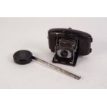 VINTAGE CORNET VOGUE BAKELITE CASED ROLL FILM POCKET CAMERA, together with a CIRCULAR BROWN BAKELITE