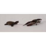 SMALL INDIAN PATINATED BRONZE MODEL OF A TURTLE, with red glass eyes, 2 ½? (6.4cm) long, together