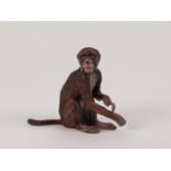 HEAVY, COLD PAINTED METAL MODEL OF A SEATED MONKEY, 3? (7.6cm) high, unmarked