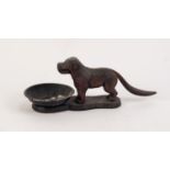 EARLY 20th CENTURY CAST IRON ARTICULATED NUT CRACKER IN THE FORM OF A STANDING DOG on base with
