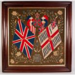 VICTORIAN EMBROIDERED NEEDLEWORK PICTURE OF BRITISH UNION AND OTHER FLAGS within a surround of