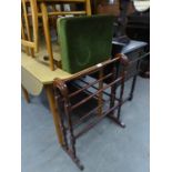 AN OAK CHEVAL TOWEL RAIL AND AN OBLONG DRESSING STOOL, IN GREEN VELVET