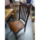 A SET OF FIVE JACOBEAN STYLE CARVED OAK RAIL BACK DINING CHAIRS, INCLUDING THE CARVER?S ARMCHAIR,