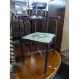 AN EDWARDIAN INLAID MAHOGANY CORNER CHAIR