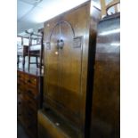 A GENTLEMAN'S ART DECO CARVED OAK SMALL SEMI FITTED WARDROBE, 2'6" WIDE