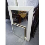 A LARGE WALL MIRROR, IN CREAM LEATHER FRAME AND A SMALLER MIRROR (2)