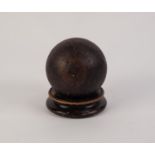 CAST IRON CANNON BALL, 4? (10.2cm) diameter, on turned wood stand
