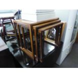 A NEST OF THREE G-PLAN TEAK WOOD OBLONG COFFEE TABLES, ON CONTINUOUS SUPPORTS