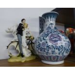 A MODERN CHINESE GLOBULAR VASE AND A RESIN ORNAMENT 'WEDDING GROUP'  (2)