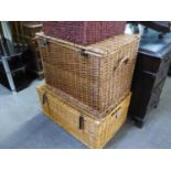 A LARGE WICKER LINEN BASKET,  76cm wide x 53cm diameter 37cm high and ANOTHER SIMILAR WICKER LINEN