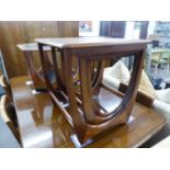 1960?S G-PLAN TEAK NEST OF THREE OBLONG COFFEE TABLES, ON CONTINUOUS SUPPORTS