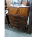 A REPRODUCTION GEORGIAN REVIVAL MAHOGANY BUREAU, WITH REEDED CANTED FORECORNERS, 29" WIDE (73.5CM)