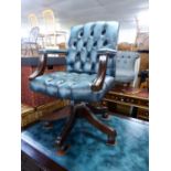 A REPRODUCTION MAHOGANY AND BLUE LEATHER OFFICE/CAPTAINS CHAIR, WITH BUTTON BACK AND SEAT, RAISED ON