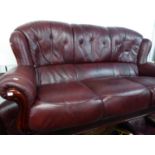 A WINGED LOUNGE SUITE OF THREE PIECES, COVERED IN RED/BROWN HIDE