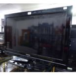 A TOSHIBA 32" FLAT SCREEN TV AND REMOTE