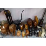 A LARGE QUANTITY OF INDIAN EBONY POLISHED WOODEN ELEPHANTS AND OTHER ANIMAL ORNAMENTS VARIOUS