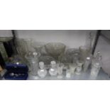 A LARGE COLLECTION OF CUT AND MOULDED GLASSWARES TO INCLUDE; BOWLS, VASES, DECANTERS ETC.....