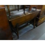 AN OAK DOUGH TROUGH, RECTANGULAR WITH LID, SLOPING SIDES, ON LEGS WITH STRETCHER RAILS, 4? LONG, 1?