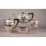 GEORGE V FOUR PIECE SILVER TEASET, of rounded oblong form with inverted corners and black angular