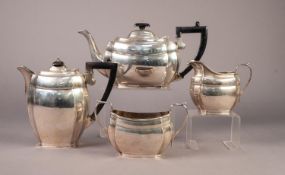 GEORGE V FOUR PIECE SILVER TEASET, of rounded oblong form with inverted corners and black angular