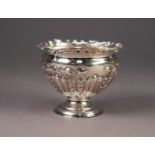 VICTORIAN EMBOSSED SILVER PEDESTAL SMALL BOWL, of part fluted form with wavy rim, decorated with