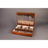 THIRTY EIGHT PIECE CANTEEN OF ELECTROPLATED CUTLERY FOR SIX PERSONS, in a walnut veneered case