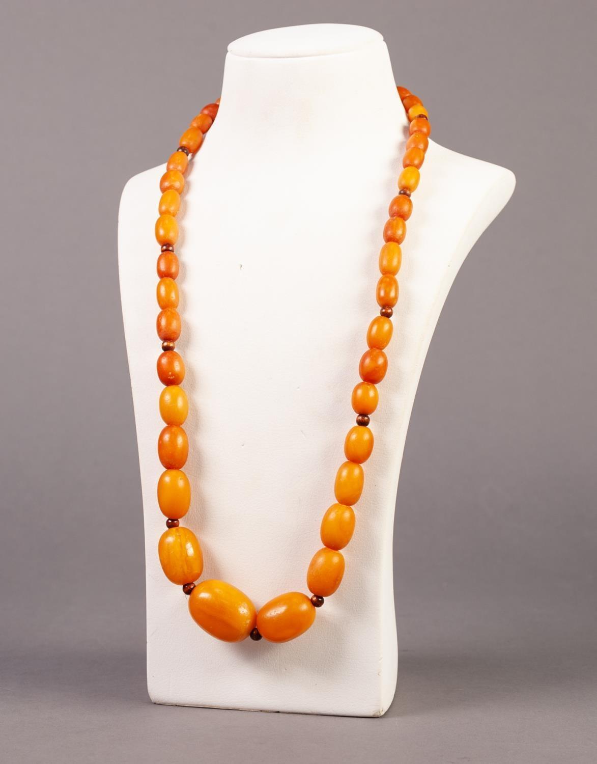 SINGLE STRAND NECKLACE OF BUTTERSCOTCH AMBER GRADUATED OVAL BEADS, with screw clasp, 25" (63.5cm) - Image 2 of 4