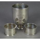 SILVER CHRISTENING MUG, the straight sided body tucked in over a domed circular foot, plain 'C'