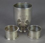SILVER CHRISTENING MUG, the straight sided body tucked in over a domed circular foot, plain 'C'