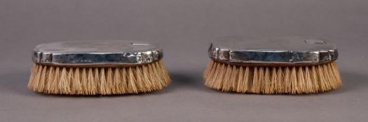 EDWARD VIII PAIR OF ENGINE TURNED SILVER BACKED MILITARY HAIRBRUSHES, of shaped oblong form,