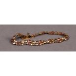 9ct GOLD TWO STRAND FANCY LINK BRACELET with safety chain, 7.2 gms
