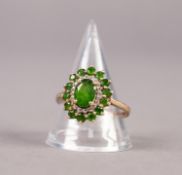 9ct GOLD, GREEN STONE AND TINY DIAMOND OVAL CLUSTER RING, set with a centre oval green stone and