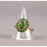 9ct GOLD, GREEN STONE AND TINY DIAMOND OVAL CLUSTER RING, set with a centre oval green stone and