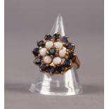 9ct GOLD, SAPPHIRE AND OPAL THREE TIER FLORAL CLUSTER RING, set with a centre small sapphire,