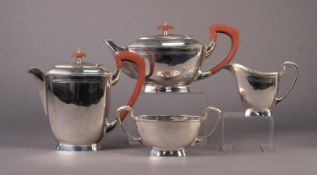 STYLISH ART DECO FOUR PIECE ELECTROPLATED TEASET, of oblong form with brown angular scroll handles