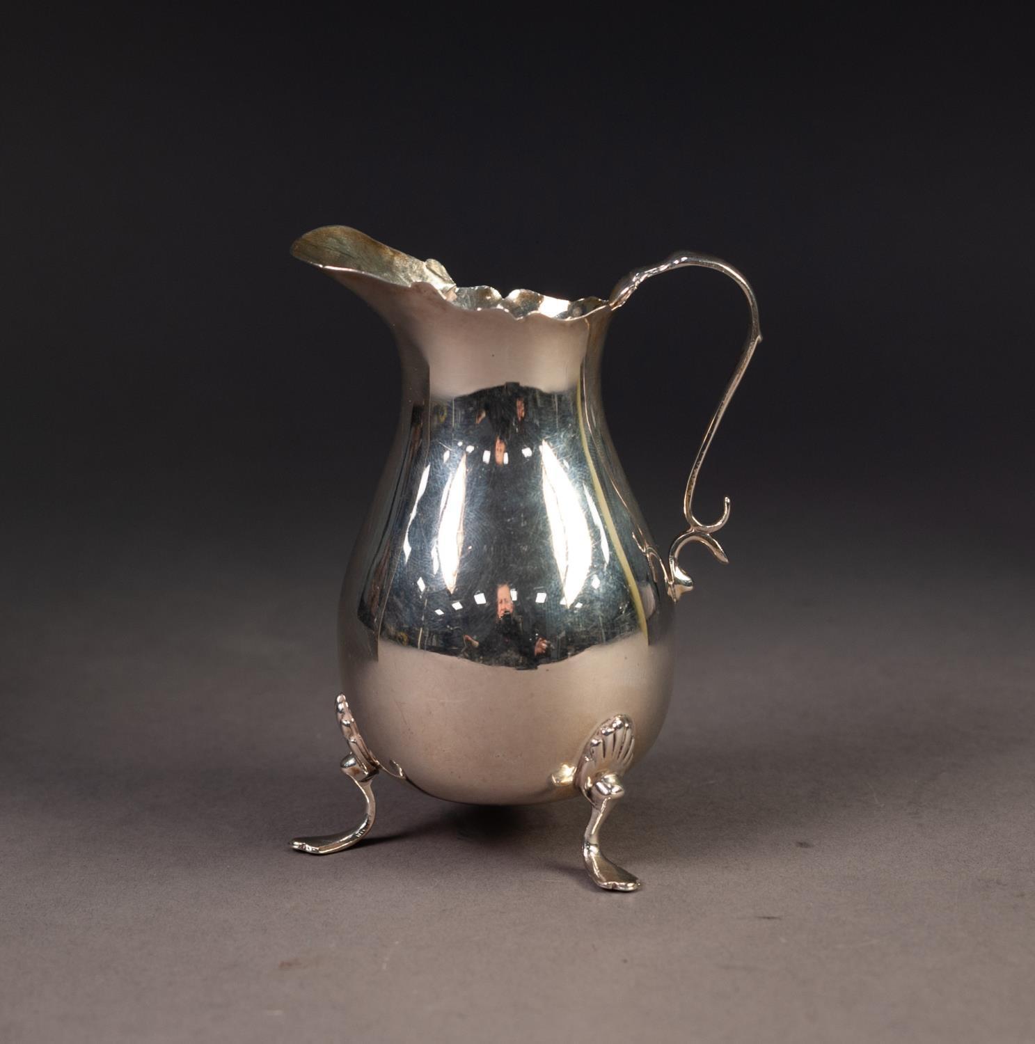 GEORGE V PLAIN SILVER CREAM JUG, of pyriform with shaped rim, scroll handle and shell capped - Image 5 of 6
