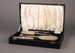 *CASED THREE PIECE ENGINE TURNED SILVER BACKED DRESSING TABLE HAND MIRROR AND BRUSH SET BY ADIE