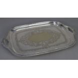 EDWARDIAN ELECTROPLATE ROUNDED OBLONG GADROONED EDGE TWO HANDLED TRAY the centre engraved with an