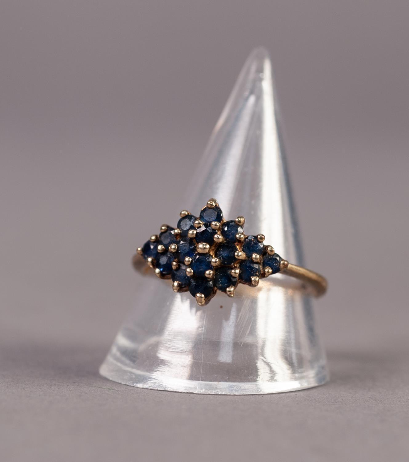 9ct GOLD AND SAPPHIRE RING, the diamond shaped top set with 16 small round sapphires, ring size R/S