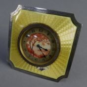 YELLOW GUILLOCHE ENAMELLED SILVER FRONTED DRESSING TABLE STRUT CLOCK, of square form with inverted