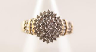 9ct GOLD AND DIAMOND DOMED CLUSTER RING, with four tiers of numerous tiny diamonds and three tier