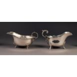 TWO SILVER SAUCE BOATS, one with scalloped rim, acanthus capped flying scroll handle and triple