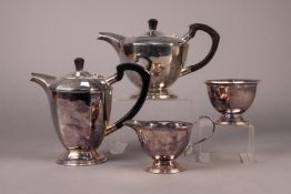 ASHBERRY FOUR PIECE ELECTROPLATED TEASET, of circular, panelled form with black scroll handles and
