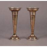 GEORGE V PAIR OF SILVER TRUMPET VASES, of typical form with pierced border and moulded bases, one
