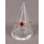 18ct GOLD RUBY AND DIAMOND CLUSTER RING, size ?N/O? 2.2 gms