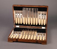 AN OAK CASE CONTAINING 12 PAIRS OS ELECTROPLATED FISH KNIVES AND FORKS with bone handles