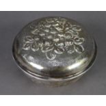 FOREIGN EMBOSSED SILVER COLOURED METAL CIRCULAR BOX AND COVER, (800 standard), with floral